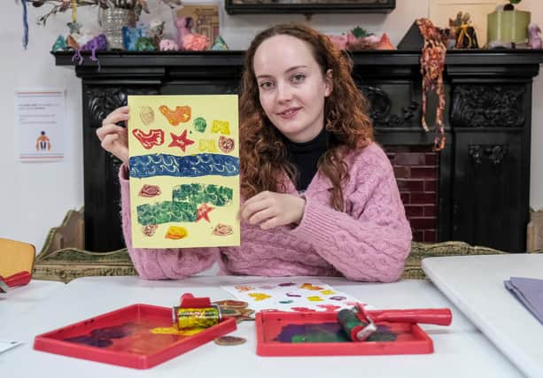 Rhian Roberts, learning officer at Scarborough Museums and Galleries with some of the bright seaside themed posters which can be made during half term activities at Scarborough Art Gallery
