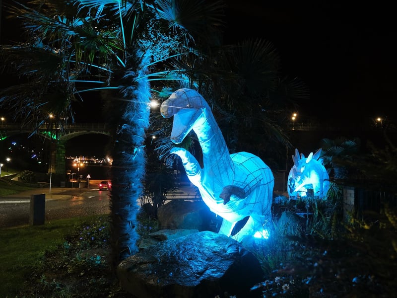 Dinosaurs glow throughout the town.