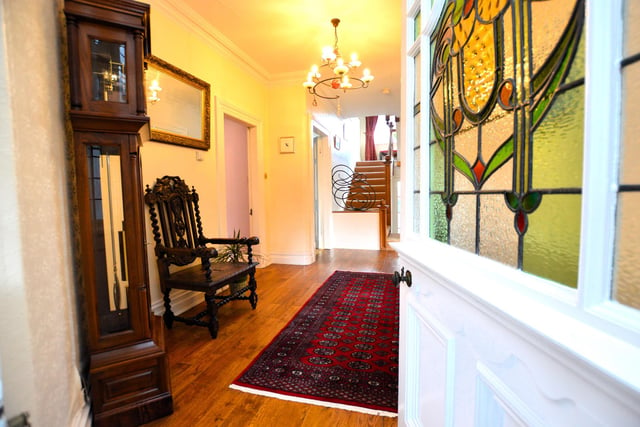 Entering the house to a spacious hallway that branches off to ground floor rooms.