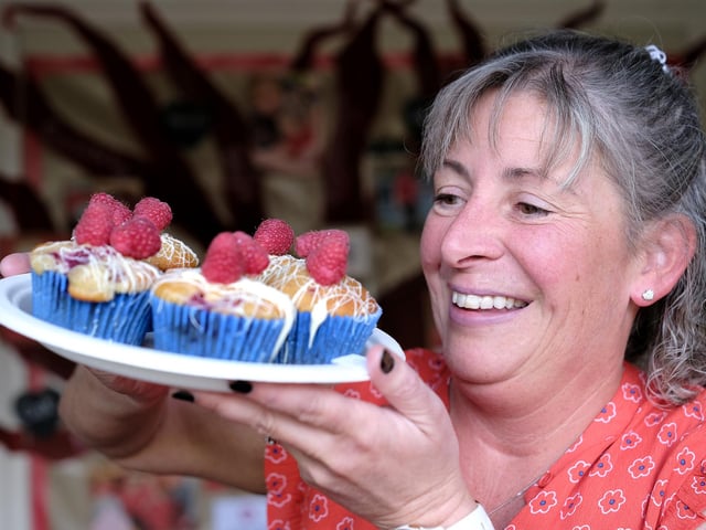 Tracey Ireland views the cakes.