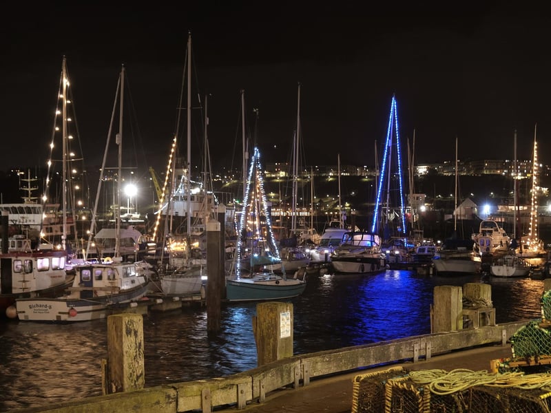 The harbour dazzles in the night sky.
