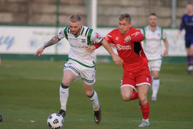 North Ferriby's Danny Earl and Brid Town's Will Sutton.