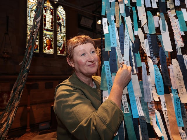 Artist Petra Ingham works on her art installation at St Mary's Church