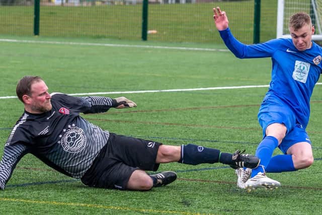 Lewis Coultas scores for Whitby Fishermen's Society Academy in their 7-0 home win against Filey Town Reserves PHOTOS BY BRIAN MURFIELD