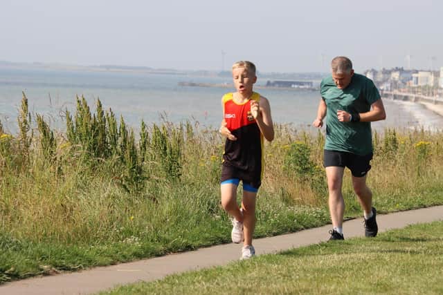 Bridlington junior star Alexander Fynn set a new Personal Best time in sweltering conditions at Sewerby on Saturday morning.