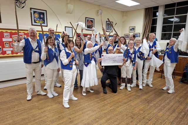 Michael Whiteley Chair of Trustees at Sparks Project with members of Yorkshire Coast Morris.
