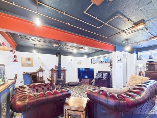 The heart of the home is this roomy interior with log burner.