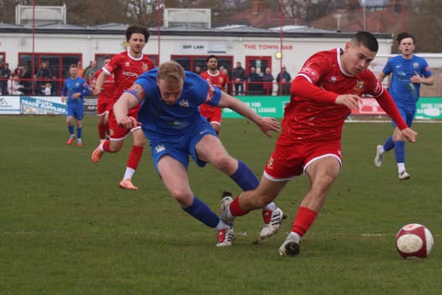 Ben Farrar is brought down to earn Brid Town's second penalty, converted by Ahmed Salam to make it 5-0. Photo by ECmedia
