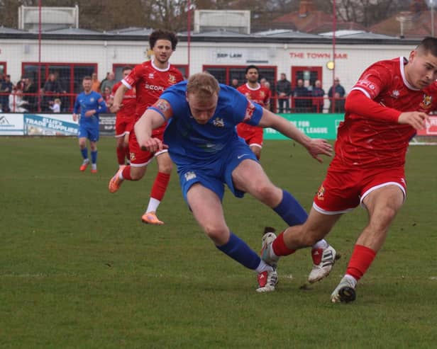 Ben Farrar is brought down to earn Brid Town's second penalty, converted by Ahmed Salam to make it 5-0. Photo by ECmedia