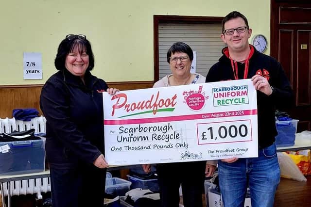 Valerie Aston presents the cheque for £1000 to Scarborough Uniform Recycle