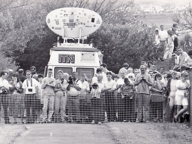 Spectators gather for a chance to witness the landslide.