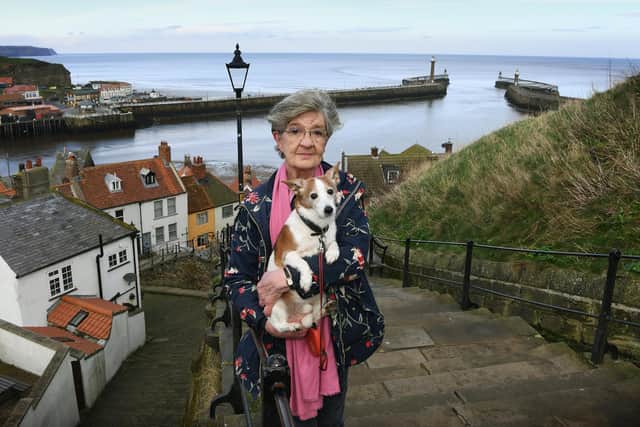 Sue Boyce, who has led the Fight4Whitby campaign since its inception, pictured with her dog Charlie on the 199 Steps.Picture: Jonathan Gawthorpe