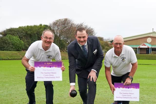 Local bowls stars Robert Child, left, and Paul Morgan, right, with the tournament's sponsor George Roberts in the middle