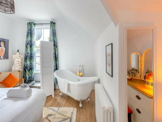 Two bedrooms on the second floor have free-standing, roll-top baths.