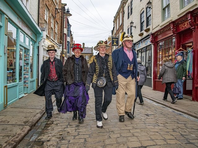 Mal Grassam, Phyllis Lampard, Gill Grassam and Stan Lampard walking through the town of Whitby during the Steampunk Weekend event.