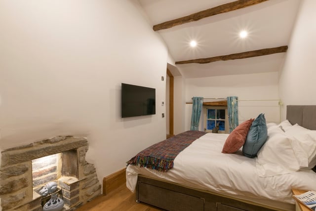 Chance's Well is a two-bedroom holiday cottage with private hot tub and feature glass-covered well in the living room.