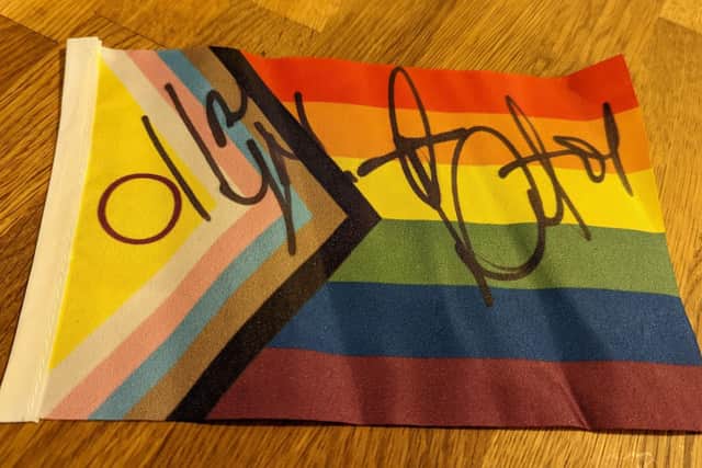 Pride flag signed by Detox