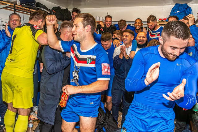 The Blues players and staff cheer the cup success.