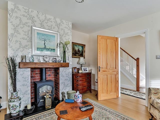 The hallway to lounge, with its gas log burning effect fire.