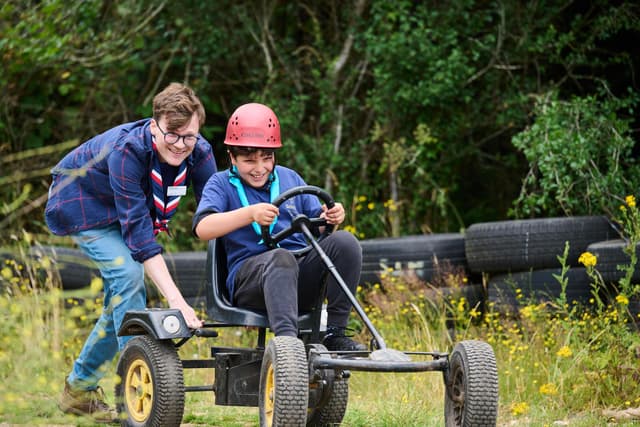 Chief Scout congratulates Filey volunteers as they help children
