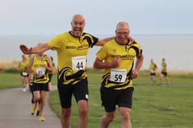 Bridlington Road Runners Chairperson Martin Hutchinson, left, enjoys an event earlier this year. PHOTO BY TCF PHOTOGRAPHY
