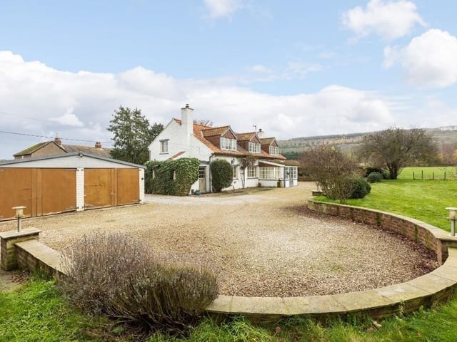 There is a large double garage with turning circle and parking area.