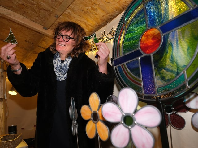 Stained glass artist Janet Fraser with her festive designs.