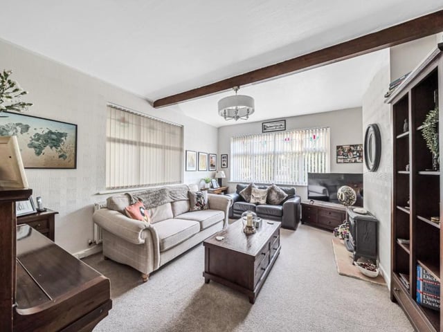 The beamed second lounge within the property is a versatile room.