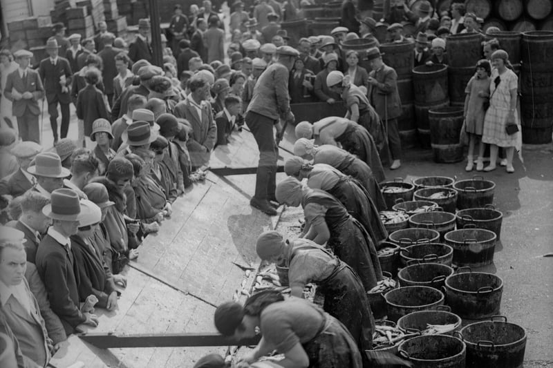 3rd September 1930: Fishergirls at work in Scarborough.
