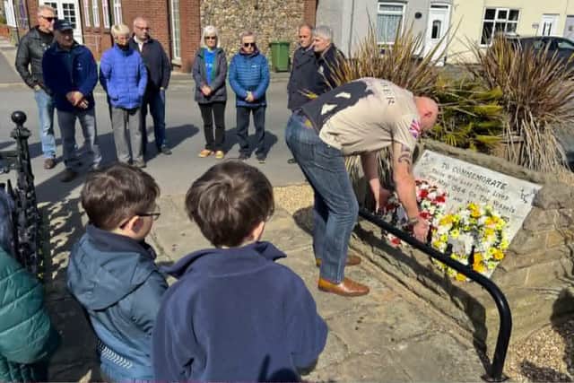 Jonathan Tree lays a wreath on behalf of the Flamborough Fishermen's Memorial Group.