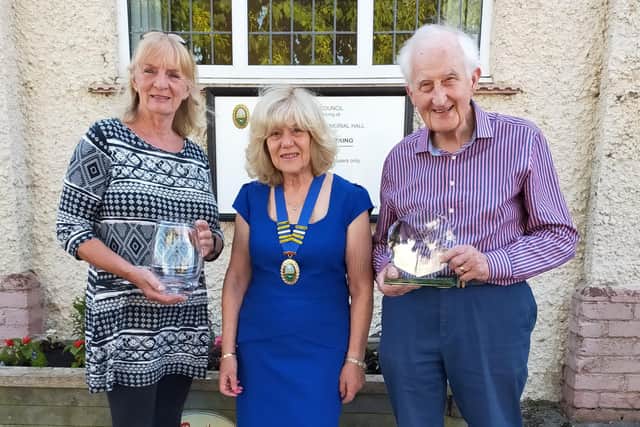​Helen Mallory and David Jeffels receive their trophies from Cllr Linda Wallis, Seamer parish council chairman.​