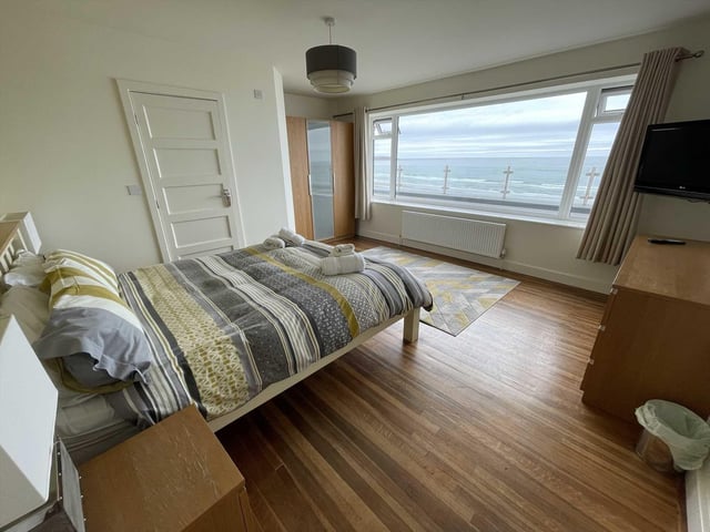 Sit up in bed and look out over this seascape.