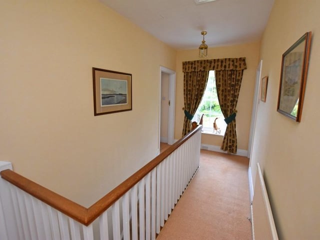 A large window brings light to the staircase and first floor landing.