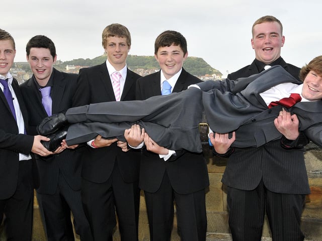 Jake Crawford gets a lift from pals.