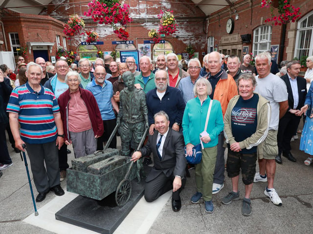 Some of the original Barrow Boys and Girls are pictures with Sculptor Stephen Carvill.