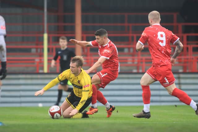 Michael Coulson challenges for the ball against Ponte. Photos by TCF Photography