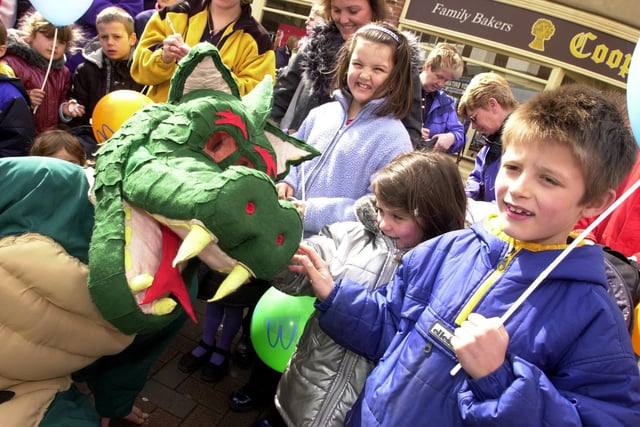 Doncaster's litter Dragon says hello to Maxine and Ryan Jimmison, aged five and eight.