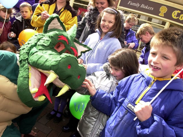 Doncaster's litter Dragon says hello to Maxine and Ryan Jimmison, aged five and eight.