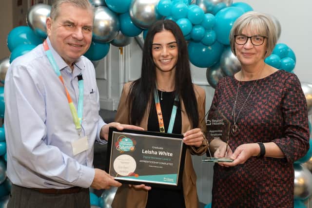 Graduating Beyond Housing apprentice Leisha White is presented with her certificate by Beyond Housing Chaiman James Hayward and CEO Rosemary Du Rose.