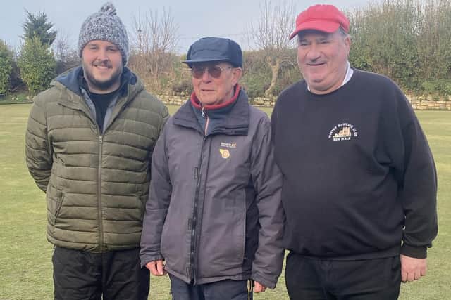 Adam Chilvers, left, and Kenny Wale, right, won the T&B final at North Cliff, trophies presented by David Hill, centre.