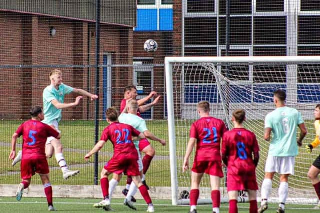 Ted Edwards heads in a goal for Edgehill in their cup win.
