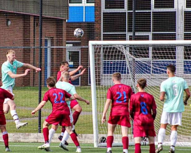 Ted Edwards heads in a goal for Edgehill in their cup win.