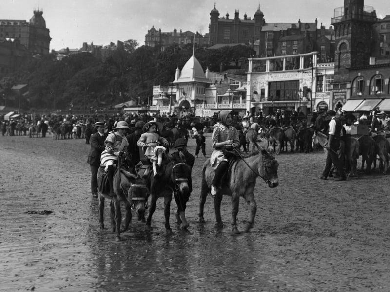 circa 1913: Donkey riding on the sands at Scarborough. (Photo by Hulton Archive/Getty Images)