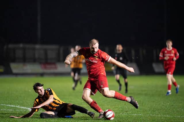 Bridlington Town striker Jake Day winds up for a shot against Brandesburton. Photo by Wandering Photography