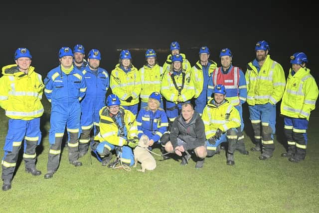 French bulldog Bruno and his owner with members of the Bridlington Coastguard Rescue Team.