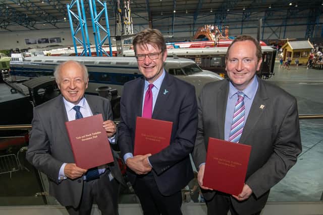 North Yorkshire County Council’s leader Carl Les (left), the Secretary of State for Levelling Up, Housing and Communities Greg Clark (centre) and City of York Council’s leader Keith Aspden (right) with signed copies of the proposed devolution deal at the National Railway Museum in York.