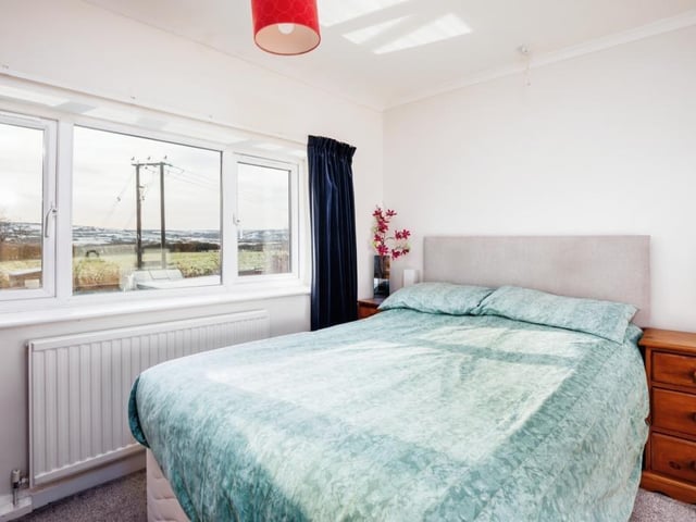 One of the bedrooms, with far reaching views from the window. There are two double bedrooms and a single bedroom with this property, with a further bedroom or office area available in the loft.