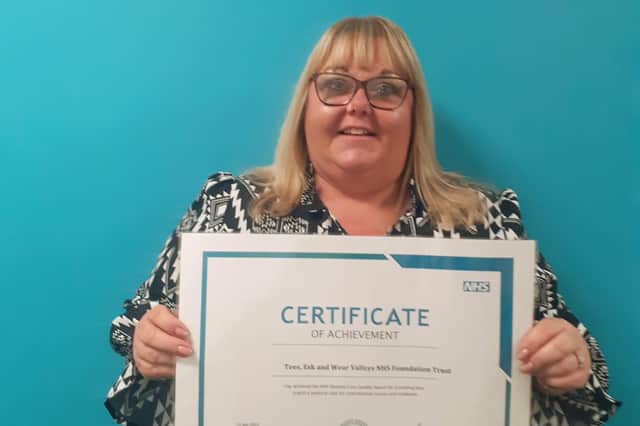 Karen Atkinson with the NHS Pastoral Care Quality Award certificate