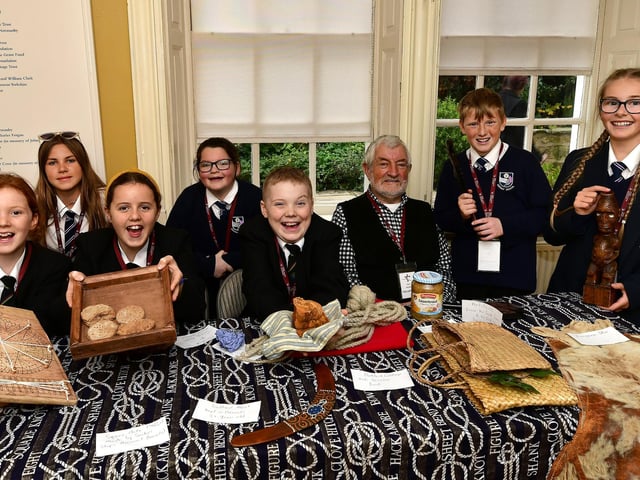 Having a great time - students with Cook Museum volunteer Paul Crooks.
picture: Richard Ponter
