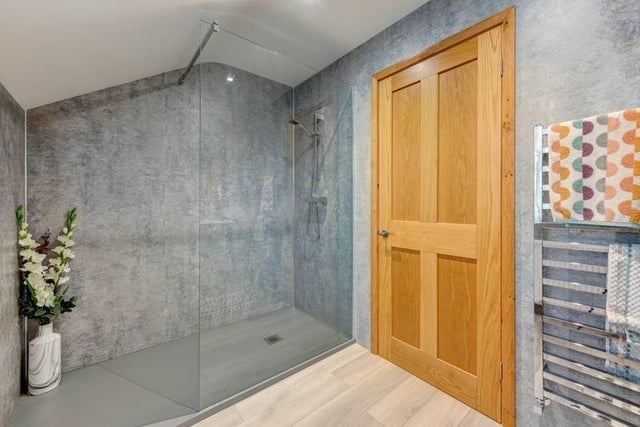 A bathroom with walk-in shower.